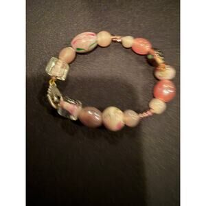 Artisan glass art bead bracelet with a silver tone toggle closure in pink